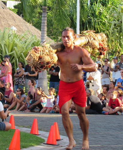 An athlet running with heavy weight out of fruit 