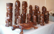 Small wooden tiki sculptures