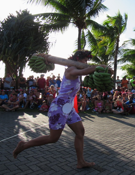 women athlet running with weights oit of fruits